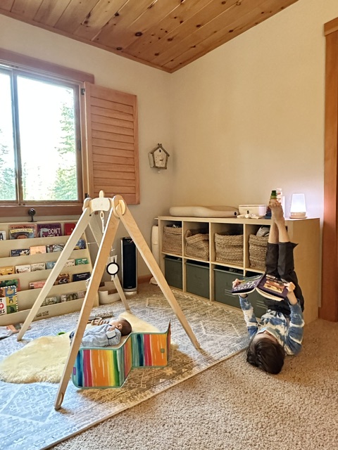 Jordan's son reading and baby playing